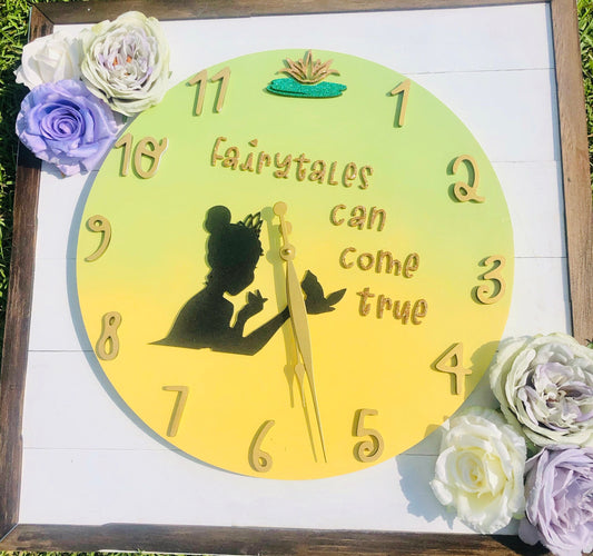 Decorative clock with fairy silhouette and 'fairytale can come true' text, surrounded by flowers.