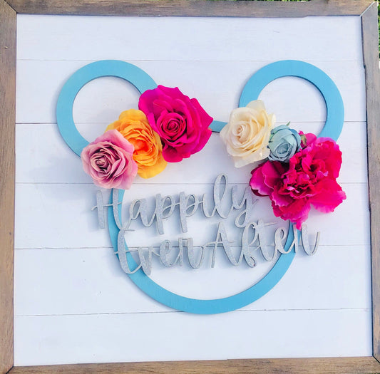 Decorative wall art with flowers and 'Happily Ever After' text on a white background.