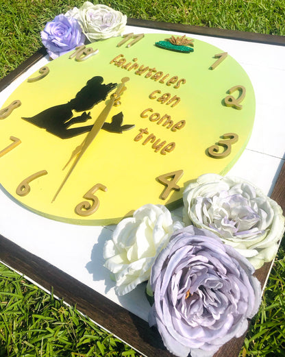 Decorative clock with floral elements on a grassy background