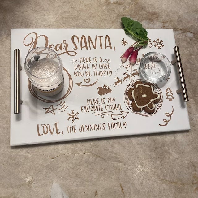 Personalized Christmas tray with Santa-themed design on a stone surface