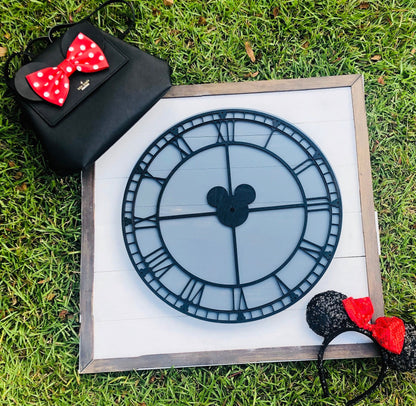 Decorative clock with Mickey Mouse design on a grassy background
