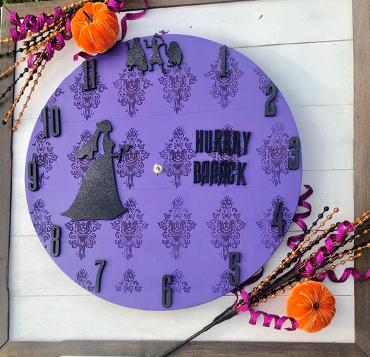 Decorative clock with Halloween theme on a wooden surface