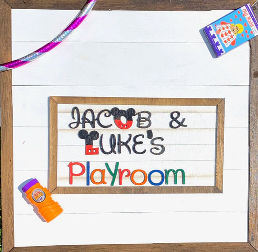 Wooden sign with 'Jacob & Luke's Playroom' text on a white background