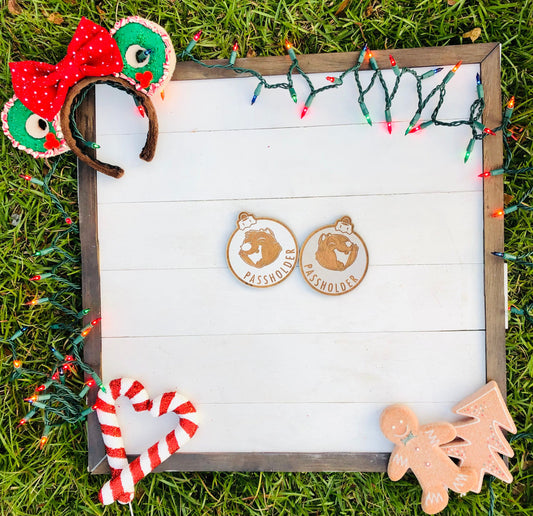 Decorative letterboard with Christmas-themed items on a grass background