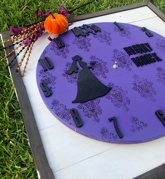 Halloween-themed clock with decorative elements on a grassy surface