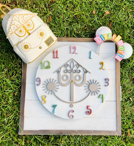 Decorative clock with colorful numbers on a grassy background